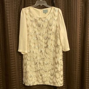 Off white shift dress. Beautiful silver and gold stitched detail. 3/4 sleeves.